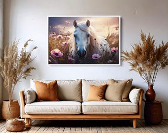 May include: A white horse with a long mane stands in a field of pink wildflowers. The horse is looking directly at the camera. The background is a soft, blurry sunset.