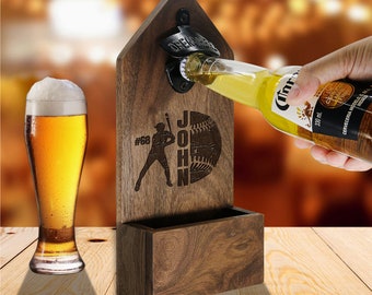 May include: Wooden bottle opener with a baseball player design and the name "John #68" engraved on it. The opener has a built-in bottle cap catcher and a slot for holding a bottle.