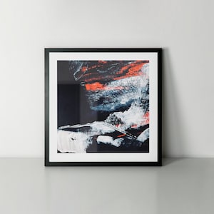 May include: Abstract art print in a black frame. The artwork features bold brushstrokes of white, navy, and orange against a dark background. The composition creates a dynamic and textured visual experience, suitable for modern decor.