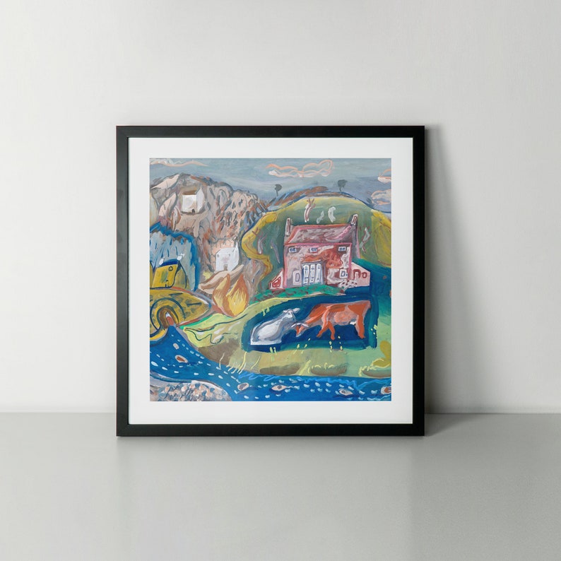 May include: A framed art print featuring a colorful landscape painting. The artwork depicts a red house, rolling green hills, a blue river, and two cows. The painting has a folk art style with a black frame.