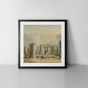 May include: A framed watercolour painting depicting Stonehenge, a prehistoric monument in England. The painting shows the iconic stone circle in a muted colour palette, with a cloudy sky in the background.