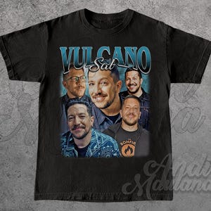 May include: Black t-shirt with a graphic print of five men. The text "Vulcano Sat" is printed above the men.