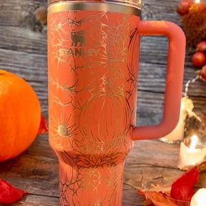 Pumpkins and flowers engraved on a 40oz and 30oz Stanley or non-branded tumbler. Pumpkin Spice