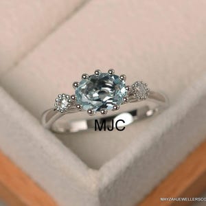 Blue Aquamarine Halo Ring: 14k White Gold, Moissanite Accents