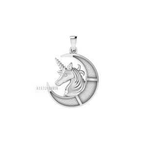 May include: Silver pendant featuring a unicorn head with a horn and a crescent moon. The pendant is detailed with a textured surface and a small gemstone in the unicorn's eye.