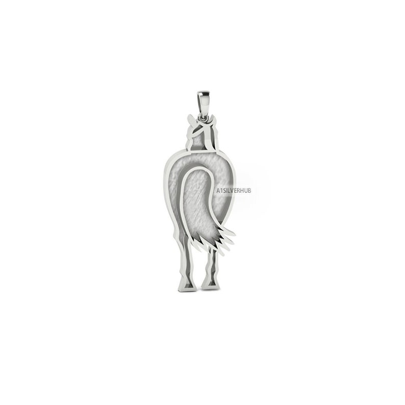 May include: Silver pendant in the shape of a horse's rear end. The pendant is detailed with a textured surface and a flowing tail.