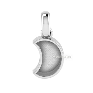 May include: A silver crescent moon charm pendant with a smooth, polished finish. The pendant has a hollow center and is designed to hold a small photo or other memento.