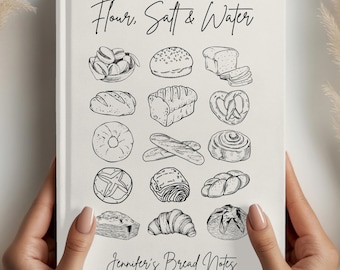 Könnte beinhalten: Ein cremefarbenes Notizbuch mit dem Text "Flour, Salt & Water" und "Jennifer's Bread Notes" in schwarzer Schrift. Das Notizbuch zeigt Strichzeichnungen verschiedener Brotsorten. Das Notizbuch wird von zwei Händen gehalten.
