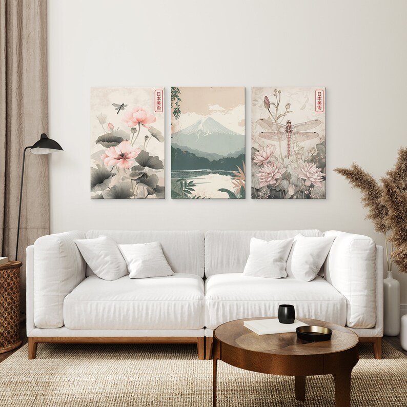 May include: Three framed prints with a Japanese theme. The left print features pink flowers and a dragonfly. The middle print shows a mountain range with a lake in the foreground. The right print features a dragonfly with pink flowers.