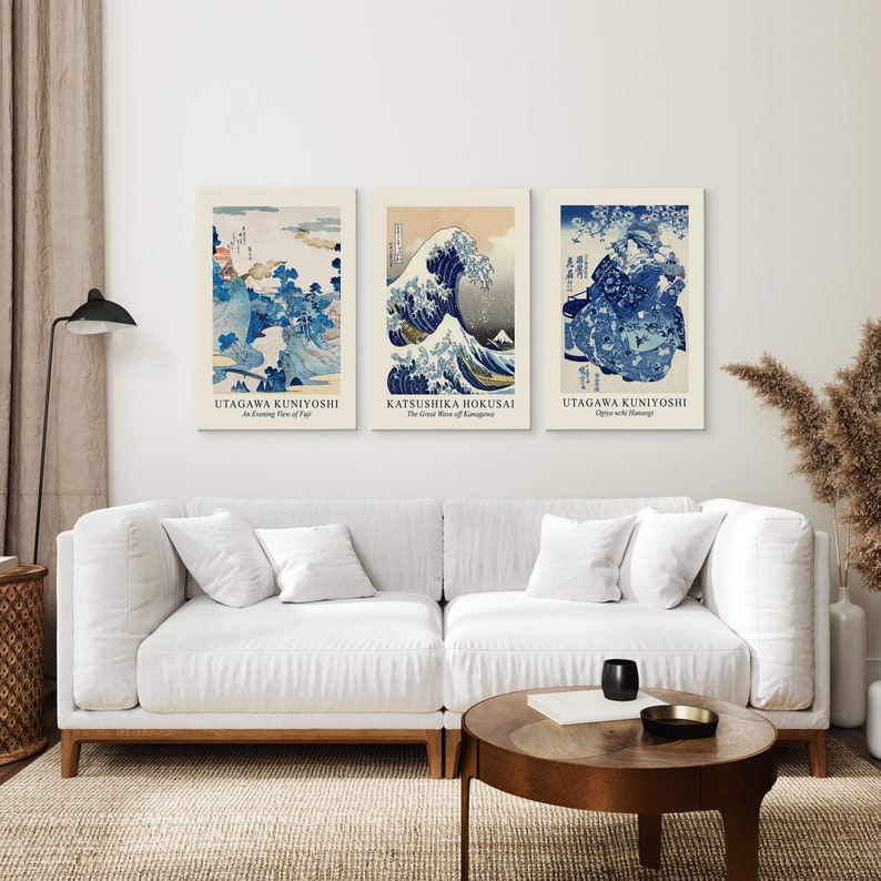 May include: Three framed Japanese woodblock prints, featuring the Great Wave off Kanagawa by Katsushika Hokusai, and two prints by Utagawa Kuniyoshi, titled "An Evening View of Fuji" and "Ojiya with Bamboo".