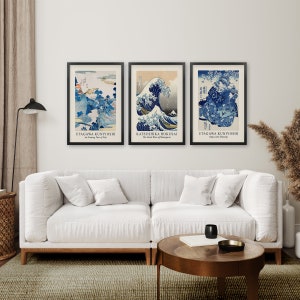 May include: Three framed Japanese woodblock prints, featuring The Great Wave off Kanagawa by Katsushika Hokusai, An Evening View of Fuji by Utagawa Kuniyoshi, and Apricots with Morning by Utagawa Kuniyoshi.
