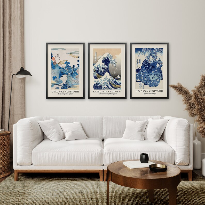 May include: Three framed Japanese woodblock prints, featuring The Great Wave off Kanagawa by Katsushika Hokusai, An Evening View of Fuji by Utagawa Kuniyoshi, and Apricots with Morning by Utagawa Kuniyoshi.
