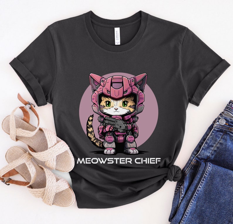 May include: A black t-shirt with a pink circle graphic of a cat wearing a pink and gray space suit holding a gun. The text "MEOWSTER CHIEF" is printed below the graphic.