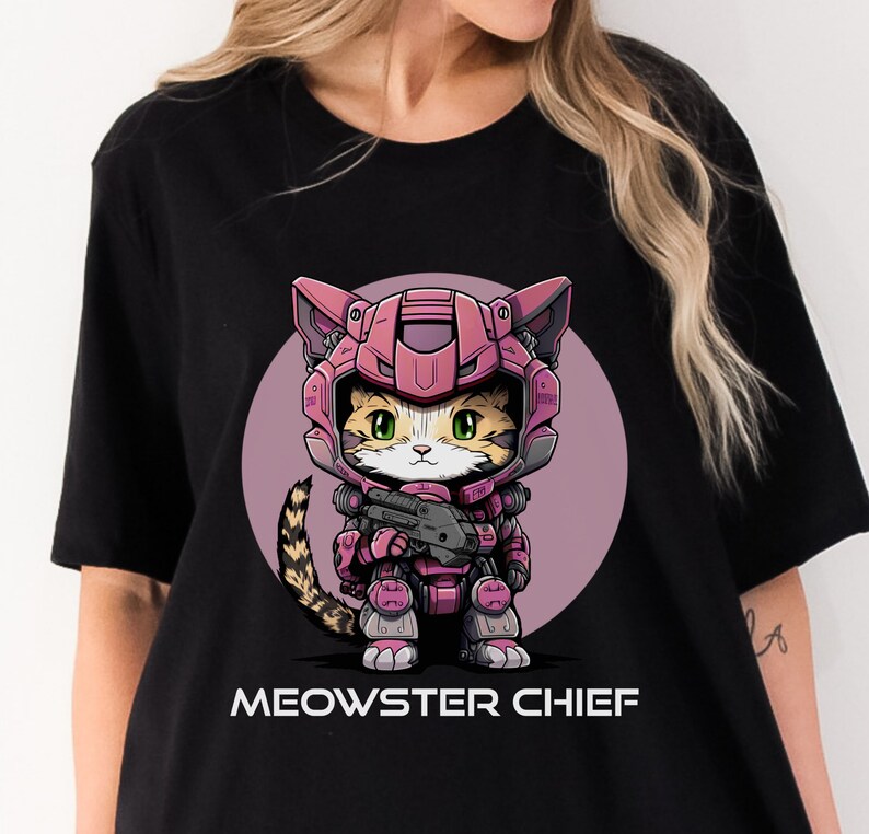 May include: Black t-shirt with a pink and gray illustration of a cat wearing a pink and gray space suit holding a gun. The text "MEOWSTER CHIEF" is printed below the illustration.