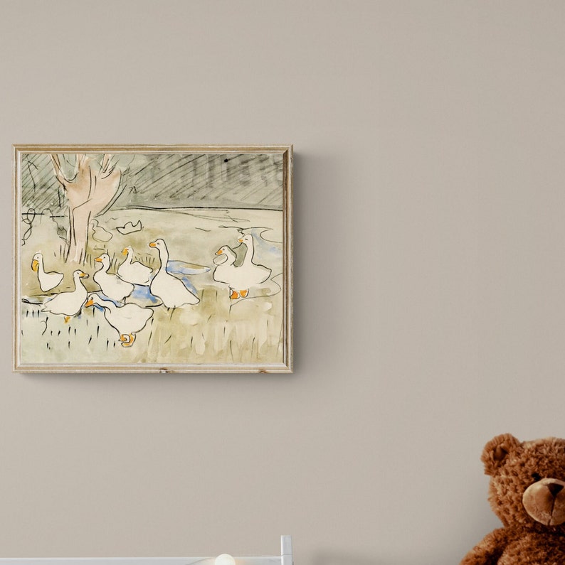 May include: A framed watercolor painting of a group of white geese in a grassy field near a pond. The geese are depicted in a simple, stylized manner, with their beaks and legs visible. The painting is set against a background of green grass and a blue pond.