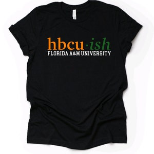 May include: Black t-shirt with the text "hbcu.ish" in orange and green letters and "FLORIDA A&M UNIVERSITY" in white letters below.