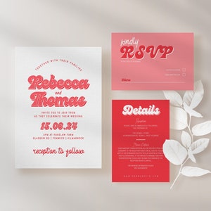 May include: Wedding invitation suite with a red and white color scheme. The main invitation features the names "Rebecca and Thomas" in a retro font. The RSVP card has a pink background and the details card has a red background.