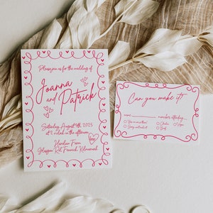 May include: Wedding invitation suite with a pink heart-themed design. The invitation includes the names Joanna and Patrick, date, time, and location. A smaller RSVP card is also included.