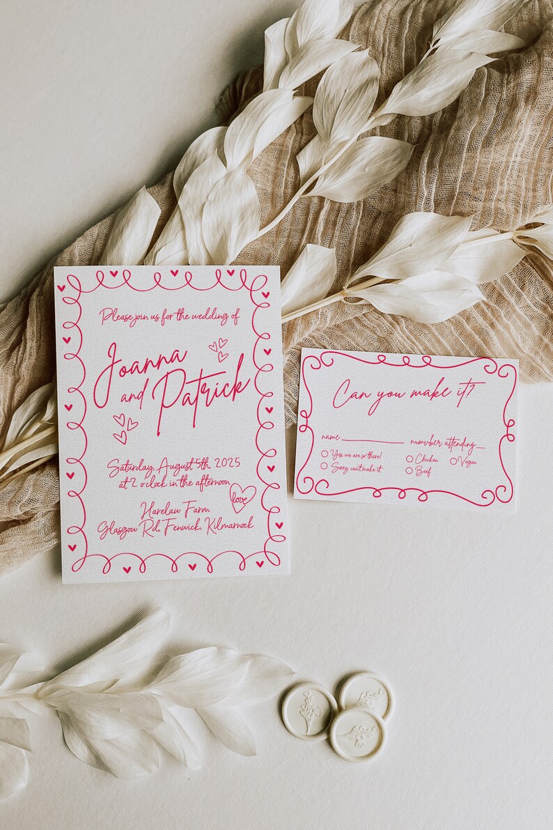 May include: Wedding invitation suite with a pink heart-themed design. The invitation includes the names Joanna and Patrick, date, time, and location. A smaller RSVP card is also included.