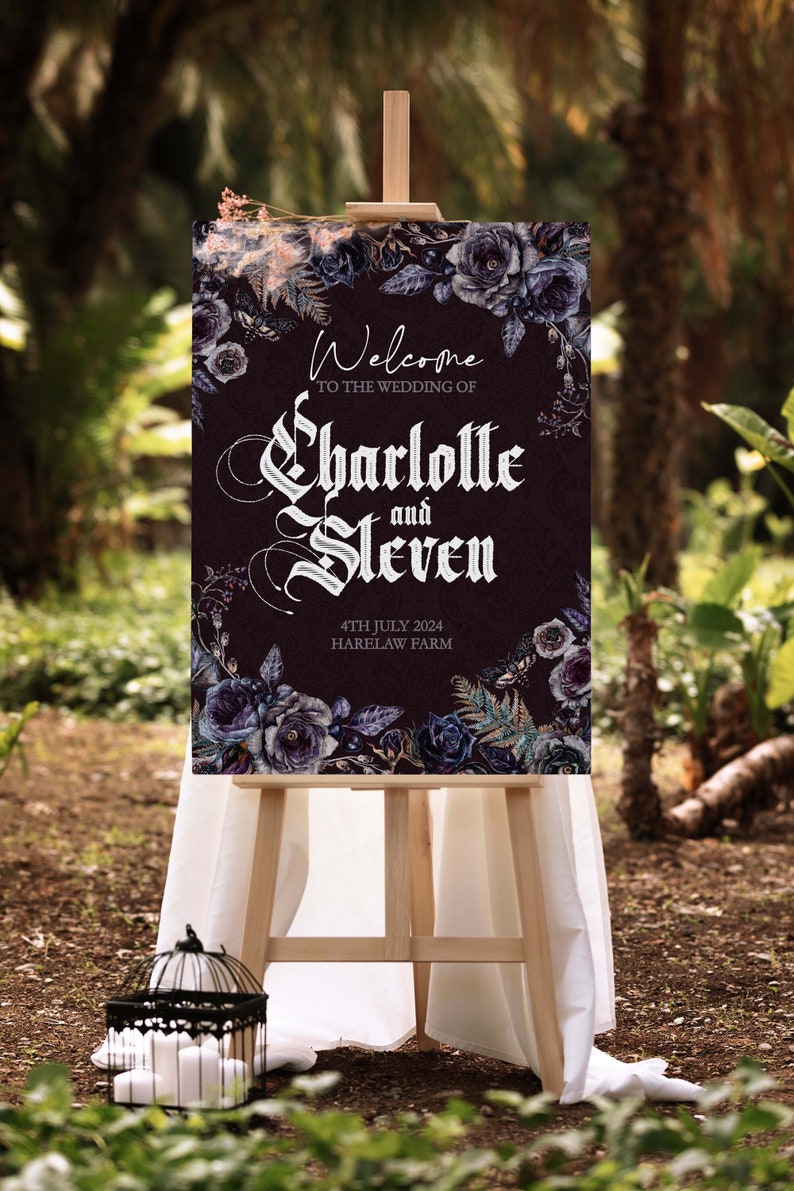May include: A dark purple wedding welcome sign with a floral design featuring black and white roses. The sign reads "Welcome to the wedding of Charlotte and Steven, 4th July 2024, Harelaw Farm".