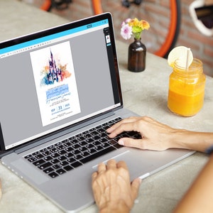 May include: A person is using a laptop to edit a digital invitation with a watercolor illustration of Cinderella's castle. The invitation is for a birthday party for Harrison James on September 31, 2023.