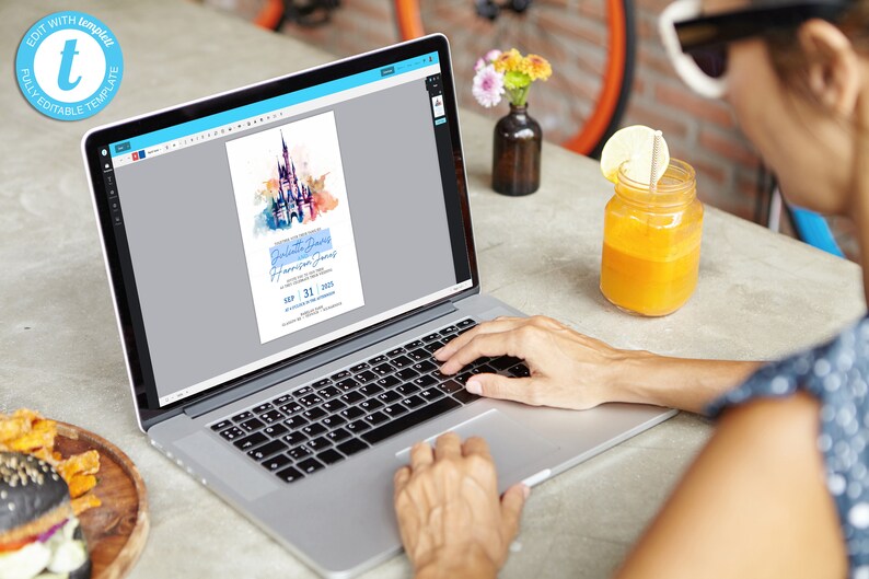 May include: A person is using a laptop to edit a digital invitation with a watercolor illustration of Cinderella's castle. The invitation is for a birthday party for Harrison James on September 31, 2023.
