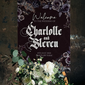 May include: A dark purple wedding welcome sign with a floral design and the text "Welcome to the wedding of Charlotte and Steven 4th July 2024 Farelaw Farm".