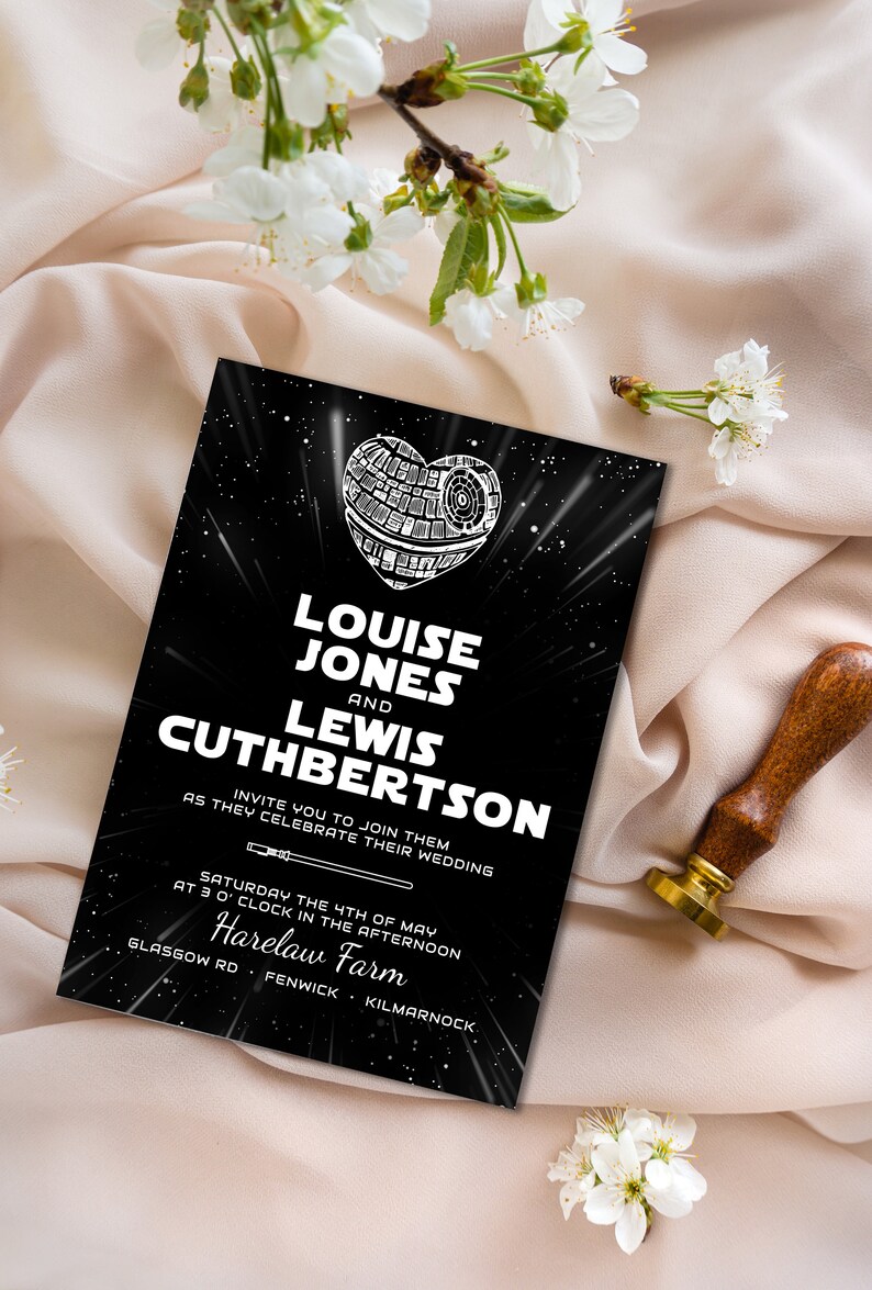 May include: A black and white wedding invitation with a Star Wars theme. The invitation features a Death Star in the shape of a heart with the text "Louise Jones and Lewis Cuthbertson" and the date and location of the wedding.