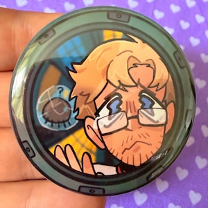 May include: A circular pinback button featuring a cartoon illustration of a blonde person with glasses looking through a dark green porthole. The person has a worried expression with blue lightning bolt shapes over their eyes. A small circular window with a question mark icon is visible in the background.