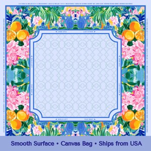 May include: A colorful canvas bag with a floral and fruit design. The bag features oranges, pink flowers, and green foliage around a light blue frame. The text "Smooth Surface" and "Canvas Bag" are visible.