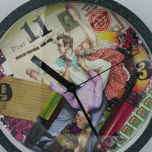 May include: Round wall clock with a black speckled frame. The clock face features a collage of vintage imagery, including postage stamps, a couple dancing, and the numbers 11 and 3. The clock hands are black.
