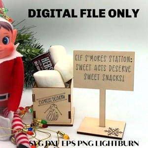Puede incluir: Una caja de madera con la etiqueta "Express Delivery" llena de malvaviscos y una barra de chocolate Hershey's. Un letrero dice "Elf S'mores Station: Sweet Acts Deserve Sweet Snacks!". El texto "DIGITAL FILE ONLY" está en la parte superior.