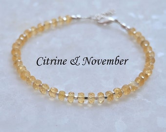 May include: A delicate citrine gemstone bracelet with a silver clasp. The bracelet is made with small, faceted citrine beads and is perfect for everyday wear. Citrine & November.