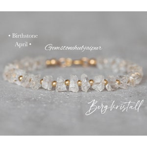 May include: A delicate bracelet made with clear quartz crystals and gold beads. The bracelet is a birthstone for April and is labelled "Bergkristall".