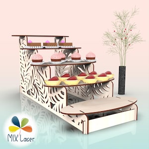 May include: A multi-tiered wooden dessert stand with a leaf design, displaying cupcakes, tarts, and small cakes. The stand has a decorative leaf pattern. The logo "MIX Laser" is visible. Ideal for showcasing baked goods.