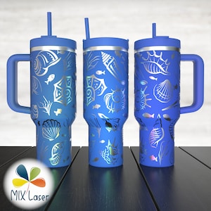 May include: Three blue stainless steel tumblers with lids and straws. Each tumbler features a different design of seashells, fish, and seaweed in a silver metallic color.