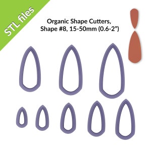 May include: Set of eight purple plastic cookie cutters in various sizes, shaped like a teardrop with a rounded top and a pointed bottom. The cutters range in size from 0.6 inches to 2 inches. The text "Organic Shape Cutters, Shape #8, 15-50mm (0.6-2")" is printed above the cutters.