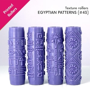 May include: Four cylindrical purple texture rollers featuring embossed Egyptian patterns, including hieroglyphs, ankh symbols, lotus flowers, and eye motifs. The text Printed Rollers and EGYPTIAN PATTERNS (#43) is visible at the top of the image.