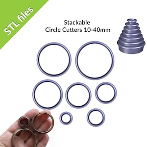 May include: A set of stackable circle cutters in various sizes, ranging from 10 to 40 millimeters. The cutters are made of a light purple plastic and are shown stacked on top of each other. The image also shows a hand holding a set of smaller circle cutters.
