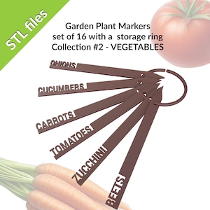 May include: A set of 16 brown plastic garden plant markers with a storage ring. The markers are labeled with the names of vegetables: Onions, Cucumbers, Carrots, Tomatoes, Zucchini, and Beets.  Garden Plant Markers set of 16 with a storage ring Collection #2 - VEGETABLES
