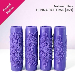 May include: Four purple texture rollers with henna patterns. Each roller has a different intricate floral and paisley design. The text "Printed Rollers" and "HENNA PATTERNS [#71]" are visible in the image.
