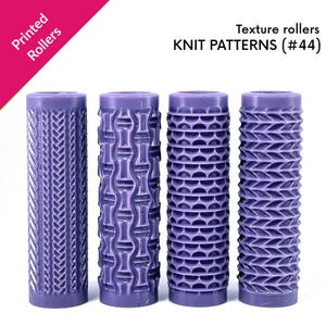 May include: Four purple texture rollers with different knit patterns. The rollers are cylindrical and feature various designs, including a chevron, bamboo, and honeycomb pattern. The text "Printed Rollers" and "Texture rollers KNIT PATTERNS (#44)" are visible.