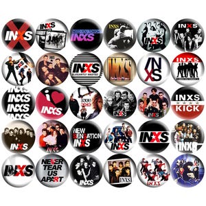 May include: A collection of round buttons featuring the band INXS. The buttons display the band's logo, album art, and song titles like "Need You Tonight" and "Kick". The buttons are primarily black, white, and red.