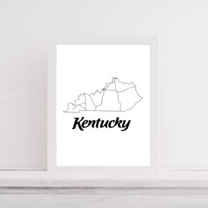 May include: A black and white line art print of the state of Kentucky with the word "Kentucky" written in a bold, cursive font below the map.
