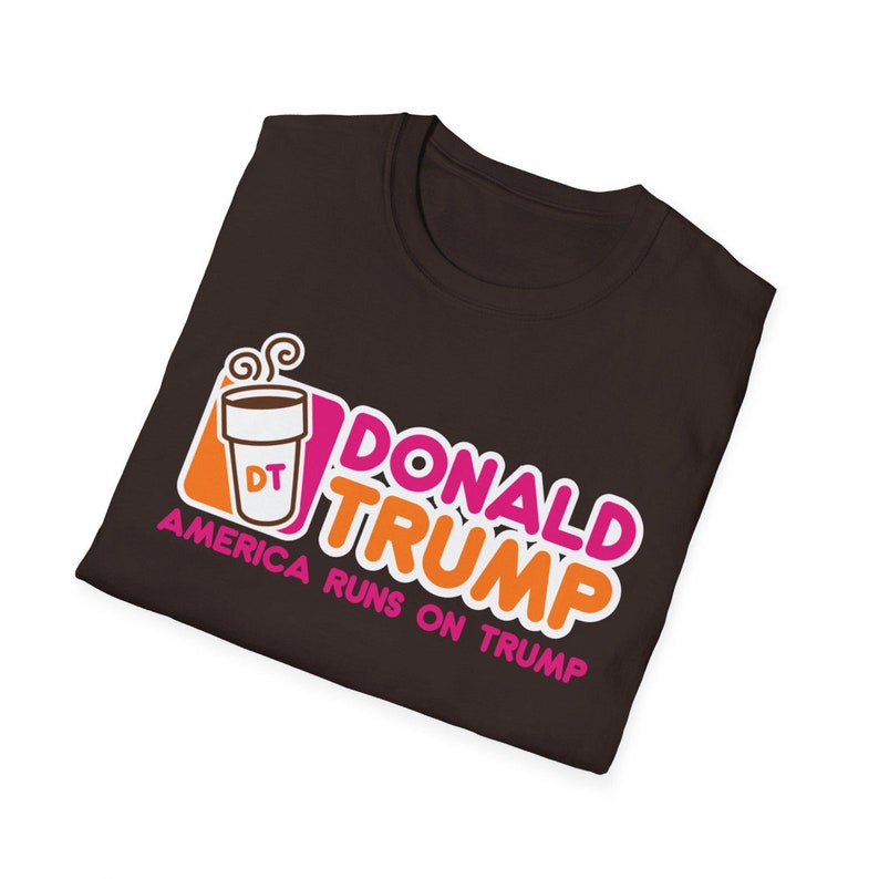 May include: A brown t-shirt with a parody of the Dunkin' Donuts logo. The logo says "Donald Trump" and "America Runs on Trump" with a coffee cup that says "DT" in the corner.
