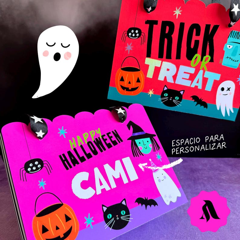 May include: Two pink and purple Halloween gift bags with black and white spider, ghost, and witch illustrations. The text on the bags reads "Happy Halloween Cami" and "Trick or Treat".