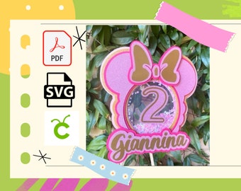Può includere: Topper per torta a tema Minnie Mouse rosa e oro con un cerchio pieno di glitter che contiene il numero 2 e il nome Giannina.