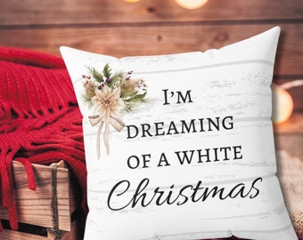 May include: White throw pillow with a floral design and the text "I'm Dreaming of a White Christmas".