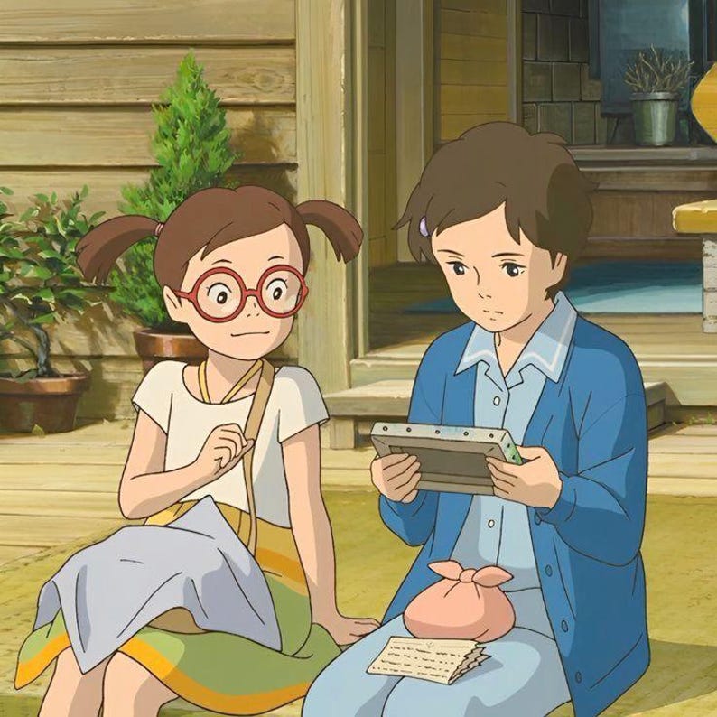 May include: Two young people are seated outdoors. One wears a white shirt, glasses, and pigtails, with a yellow and green skirt. The other wears a blue jacket and holds a framed picture. A pink pouch and a letter are nearby.