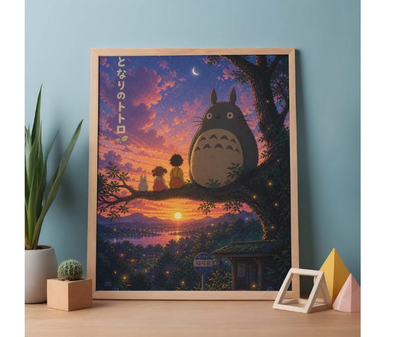 May include: A framed print featuring a scene from the animated film, "My Neighbor Totoro." The artwork depicts Totoro sitting on a tree branch with two children, set against a sunset sky. The Japanese text "となりのトトロ" is visible.
